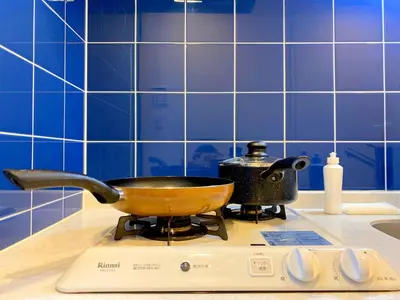 a frying pan on a stove in a kitchen at Pangoo Shinagawa Room 304 - Vacation STAY 18366 in Tokyo