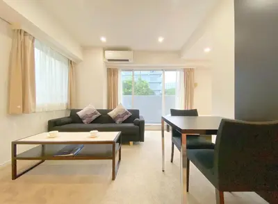 a living room with a couch and a table at Pangoo Shinagawa Room 306 - Vacation STAY 18372 in Tokyo