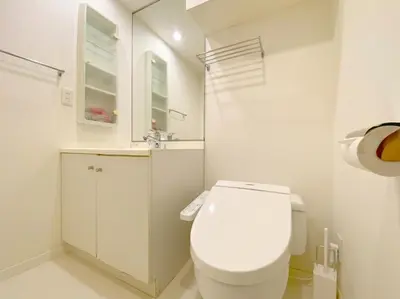 a white bathroom with a toilet and a sink at Pangoo Shinagawa Room 306 - Vacation STAY 18372 in Tokyo