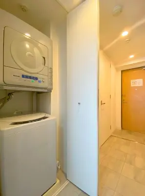 a microwave on top of a refrigerator in a room at Pangoo Shinagawa Room 402 - Vacation STAY 99354v in Tokyo