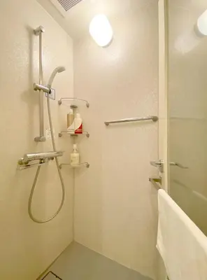 a bathroom with a shower and a glass door at Pangoo Shinagawa Room 403 - Vacation STAY 99365v in Tokyo