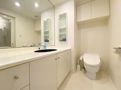 a white bathroom with a toilet and a sink at Pangoo Shinagawa Room 405 - Vacation STAY 18374 in Tokyo
