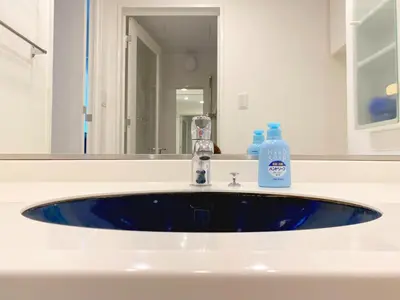 a bathroom sink with a blue soap bottle on it at Pangoo Shinagawa Room 405 - Vacation STAY 18374 in Tokyo