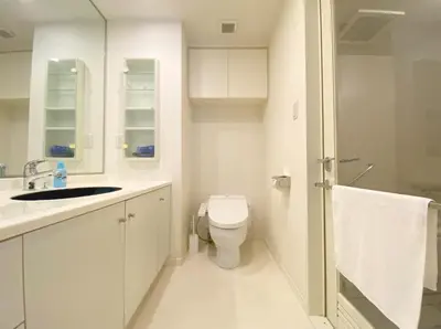 a white bathroom with a toilet and a sink at Pangoo Shinagawa Room 405 - Vacation STAY 18374 in Tokyo