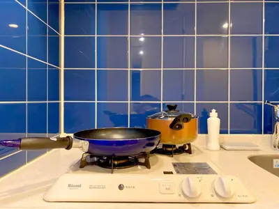 a frying pan on a stove in a kitchen at Pangoo Shinagawa Room 406 - Vacation STAY 18375 in Tokyo