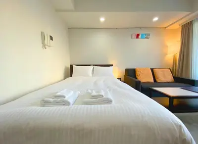 a hotel room with a bed with towels on it at Pangoo Shinagawa Room 503 - Vacation STAY 00026v in Tokyo