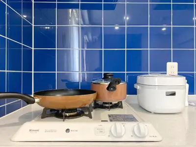 a kitchen counter with two pans on a stove at Pangoo Shinagawa Room 601 - Vacation STAY 00052v in Tokyo