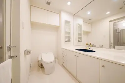 a white bathroom with a toilet and a sink at angoo Shinagawa Room 603 - Vacation STAY 00071v in Tokyo