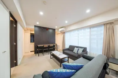 a living room with a couch and a table at angoo Shinagawa Room 603 - Vacation STAY 00071v in Tokyo
