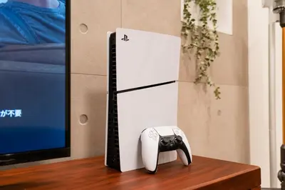 a white refrigerator with a phone next to a tv at \u5168\u65b0\u4e09\u4e4b\u8f6e\u8c6a\u534e\u4e00\u6237\u5efaa\u680b in Tokyo