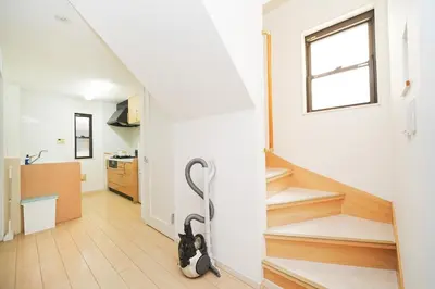 a hallway with a staircase in a house at Panda Style 3-story 9ppl House FreeParking 3br&tub in Tokyo