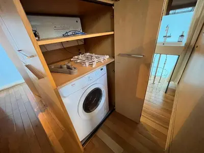 a washer and dryer in a tiny house at Natsumezaka Room3 NM3 in Tokyo