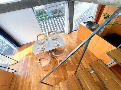 a room with a table and chairs and a window at Natsumezaka Room3 NM3 in Tokyo