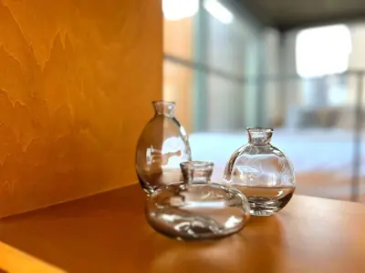 two glass vases sitting on top of a table at Natsumezaka Room3 NM3 in Tokyo