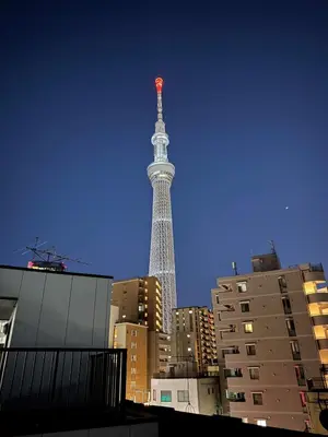 a view of the eiffel tower in a city at sun inn in Tokyo