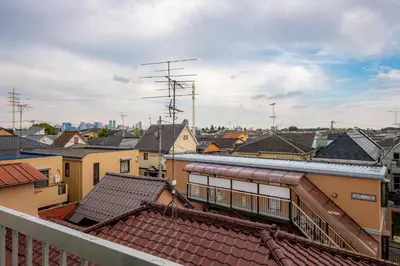 a view of a city with roofs and buildings at #16 -\u65b0\u9ad8\u5186\u5bfa \u30e1\u30be\u30f3\u30e2\u30ea\u30bf- Studio in Tokyo