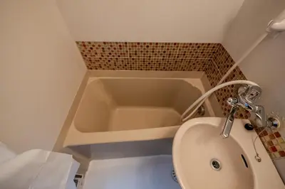 a bathroom with a sink and a bath tub at #16 -\u65b0\u9ad8\u5186\u5bfa \u30e1\u30be\u30f3\u30e2\u30ea\u30bf- Studio in Tokyo