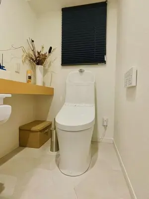 a white toilet in a bathroom with a window at World House Kameido -Direct to Akihabara&Shinjuku, near Asakusa &Skytree, 30 mins to Disney by train in Tokyo