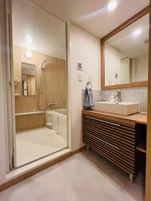 a bathroom with a sink and a shower and a mirror at World House Kameido -Direct to Akihabara&Shinjuku, near Asakusa &Skytree, 30 mins to Disney by train in Tokyo