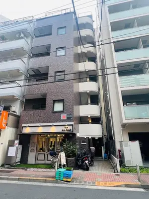 a building with a motorcycle parked in front of it at World House Kameido -Direct to Akihabara&Shinjuku, near Asakusa &Skytree, 30 mins to Disney by train in Tokyo