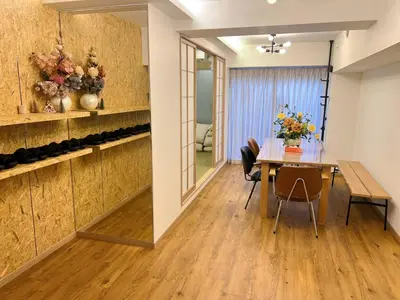 a dining room with a table and chairs at World House Kameido -Direct to Akihabara&Shinjuku, near Asakusa &Skytree, 30 mins to Disney by train in Tokyo