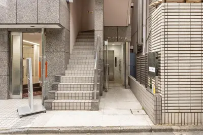 a building with stairs in front of a building at \u30ab\u30e1\u30ea\u30a2\u30d3\u30eb in Tokyo