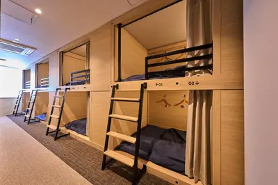 a group of bunk beds in a room at GRAND HOSTEL LDK Tokyo Nishikasai -GRAND OPENING In May 2025- in Tokyo
