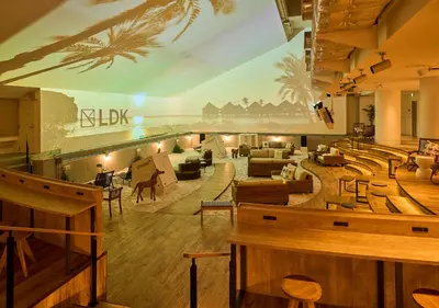 a lobby of a hotel with tables and chairs at GRAND HOSTEL LDK Tokyo Nishikasai -GRAND OPENING In May 2025- in Tokyo