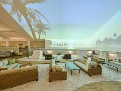 a living room with couches and chairs and the ocean at GRAND HOSTEL LDK Tokyo Nishikasai -GRAND OPENING In May 2025- in Tokyo