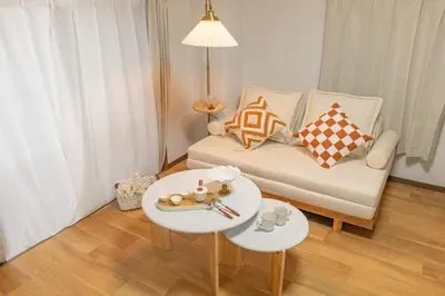 a small living room with a couch and a table at Shinjuku 2 stops new mansion free WiFi nakano area in Tokyo