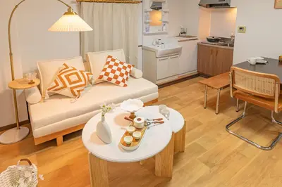 a living room with a couch and a table at Shinjuku 2 stops new mansion free WiFi nakano area in Tokyo