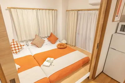 a bedroom with a bed with a pumpkin on it at Shinjuku 2 stops new mansion free WiFi nakano area in Tokyo