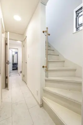 a hallway with stairs in a house at Sangenjaya 102 square meters 3 Bedroom 2 bathrooms in Tokyo