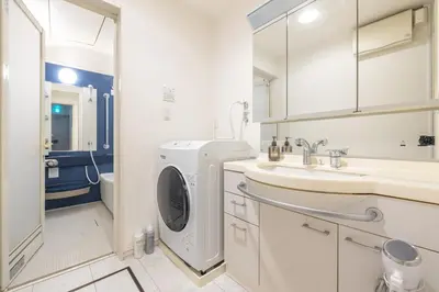 a bathroom with a washing machine and a sink at Sangenjaya 102 square meters 3 Bedroom 2 bathrooms in Tokyo