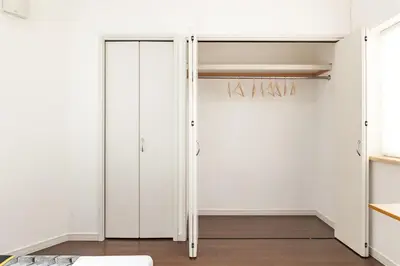 a room with white walls and a sliding closet door at Sangenjaya 102 square meters 3 Bedroom 2 bathrooms in Tokyo