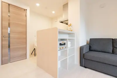 a living room with a couch and a chair at House hotel EKODA 202 HE22 in Tokyo