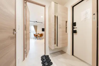 a hallway with a glass door leading to a dining room at House hotel EKODA 202 HE22 in Tokyo