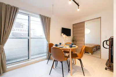 a room with a table and chairs and a large window at House hotel EKODA 202 HE22 in Tokyo