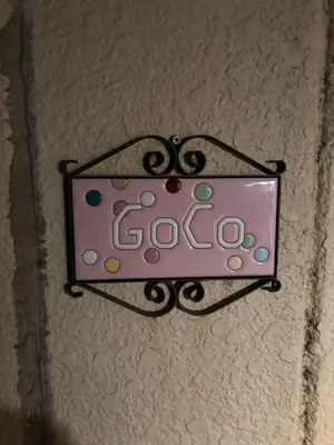 a sign that says go hanging on a wall at \u6c60\u888b\u672c\u753a3,4\u968e in Tokyo