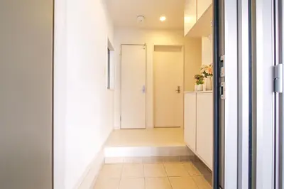 a hallway with a door leading into a room at Yahiro Villa in Tokyo