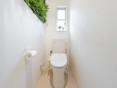 a white toilet in a bathroom with a window at Shinjuku 2min 140 Square meters VR Switch Photo Booth pc in Tokyo