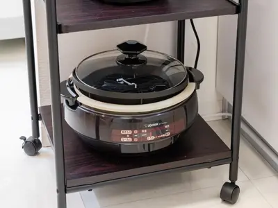a slow cooker on a stand in a kitchen at Shinjuku 2min 140 Square meters VR Switch Photo Booth pc in Tokyo
