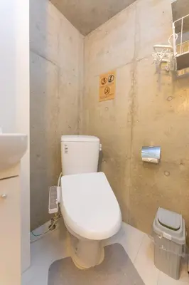 a bathroom with a white toilet and a sink at Fox & Fortune 4A -Nomad Stay- 3-min Walk, PS5, Apple Studio in Tokyo