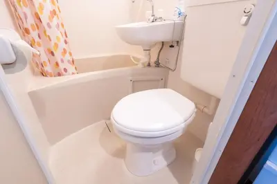 a small bathroom with a toilet and a sink at 25Yamanote JR line Takadanobaba sat 5mit Netflix watch!Up to 3 people! in Tokyo