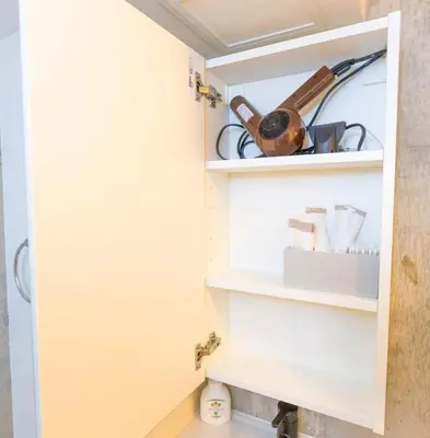 a cupboard in a kitchen with cooking utensils at Fox & Fortune 4B -New Near station Luggage storage Netflix- in Tokyo