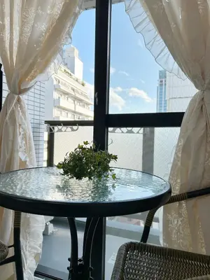 a glass table in front of a window with a plant at Ikebukuro Center# Ikebukuro 5min walk#\u6c60\u888b\u4e2d\u5fc3\u5730\u5e26# \u6c60\u888b\u8f66\u7ad9\u6b65\u884c5\u5206#\u65e0\u9650\u5236wifi#1110 in Tokyo