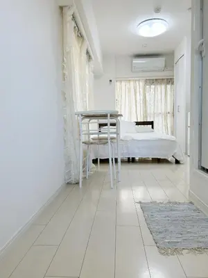 a white room with a bed and a table and a bedroom at Ikebukuro Center# Ikebukuro 5min walk#\u6c60\u888b\u4e2d\u5fc3\u5730\u5e26# \u6c60\u888b\u8f66\u7ad9\u6b65\u884c5\u5206#\u65e0\u9650\u5236wifi#1110 in Tokyo