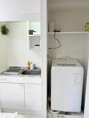 a white kitchen with a sink and a refrigerator at Ikebukuro Center# Ikebukuro 5min walk#\u6c60\u888b\u4e2d\u5fc3\u5730\u5e26# \u6c60\u888b\u8f66\u7ad9\u6b65\u884c5\u5206#\u65e0\u9650\u5236wifi#1110 in Tokyo