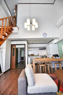 an open kitchen and dining room with a table and chairs at Alice\u5c0f\u5c4b601 in Tokyo