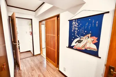 a hallway with a painting on the wall at Alice\u5c0f\u5c4b601 in Tokyo